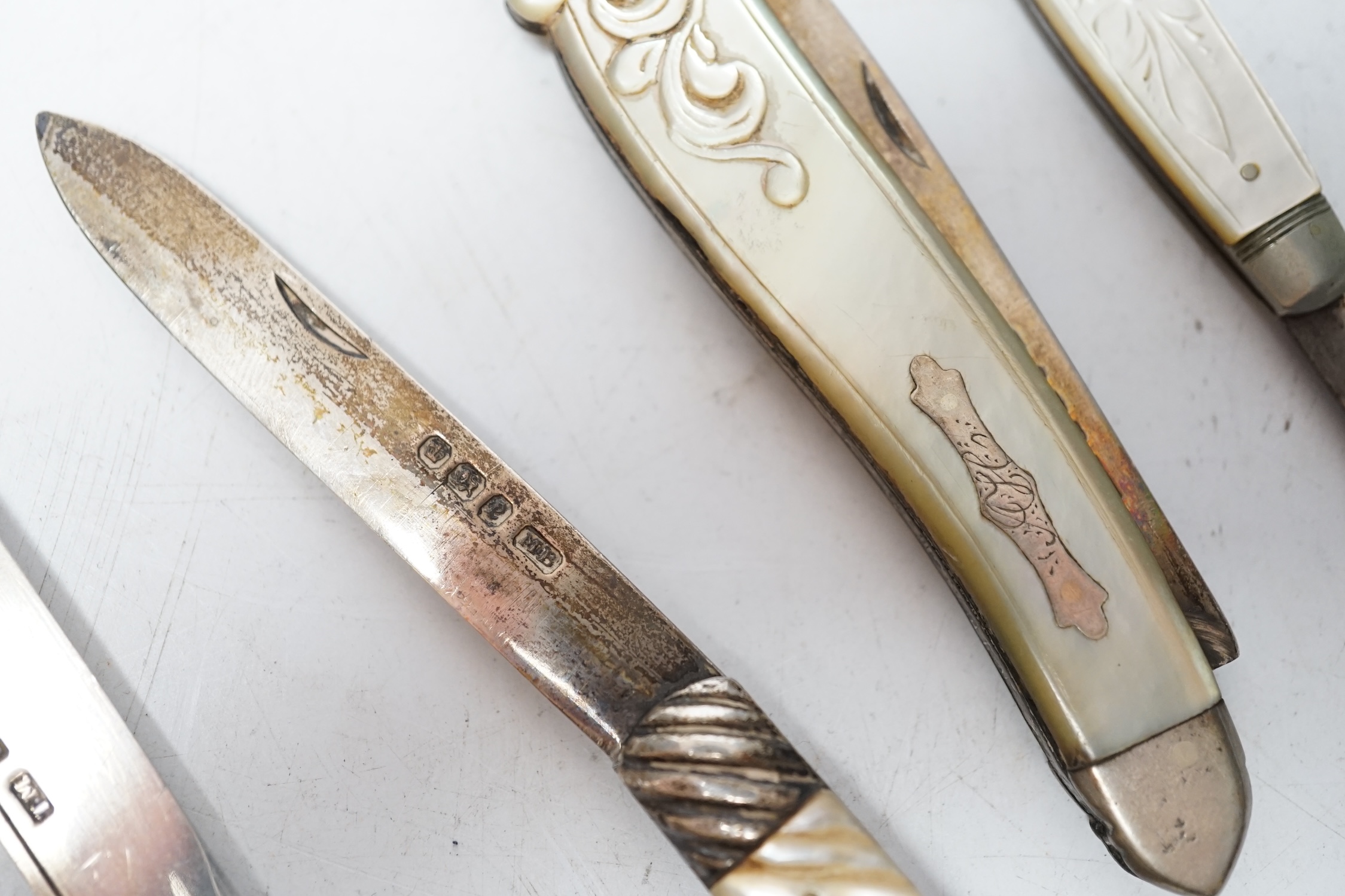 Four assorted Victorian silver and mother of pearl fruit knives, largest Francis Clark, Birmingham, 1843, 90mm. Condition - fair.